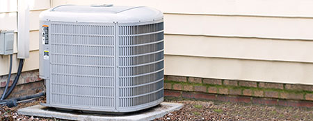 energy efficient central air conditioner unit outside of home